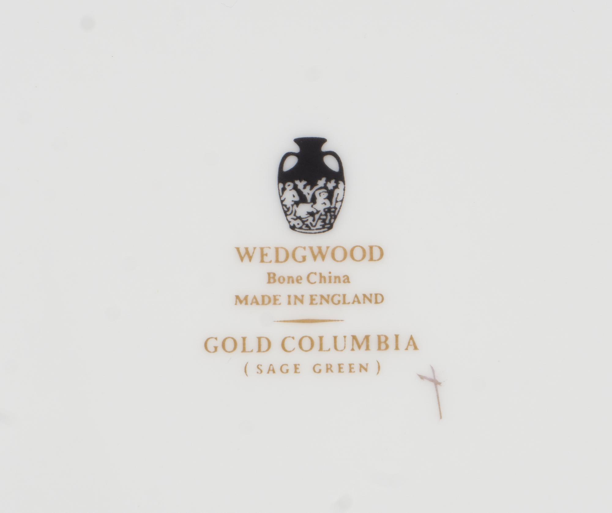 A Wedgwood Gold Columbia Porcelain Dinner Service