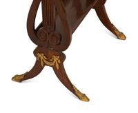 A French Empire Gilt Metal Mounted Mahogany Work Table