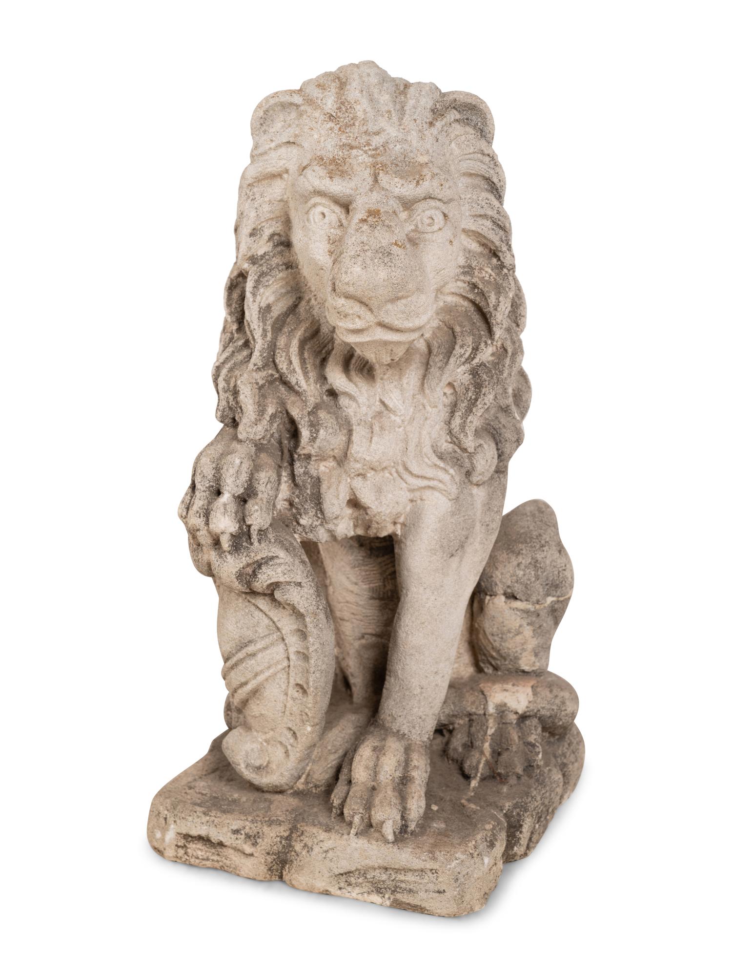 A Pair of Cast Stone Lion Figures