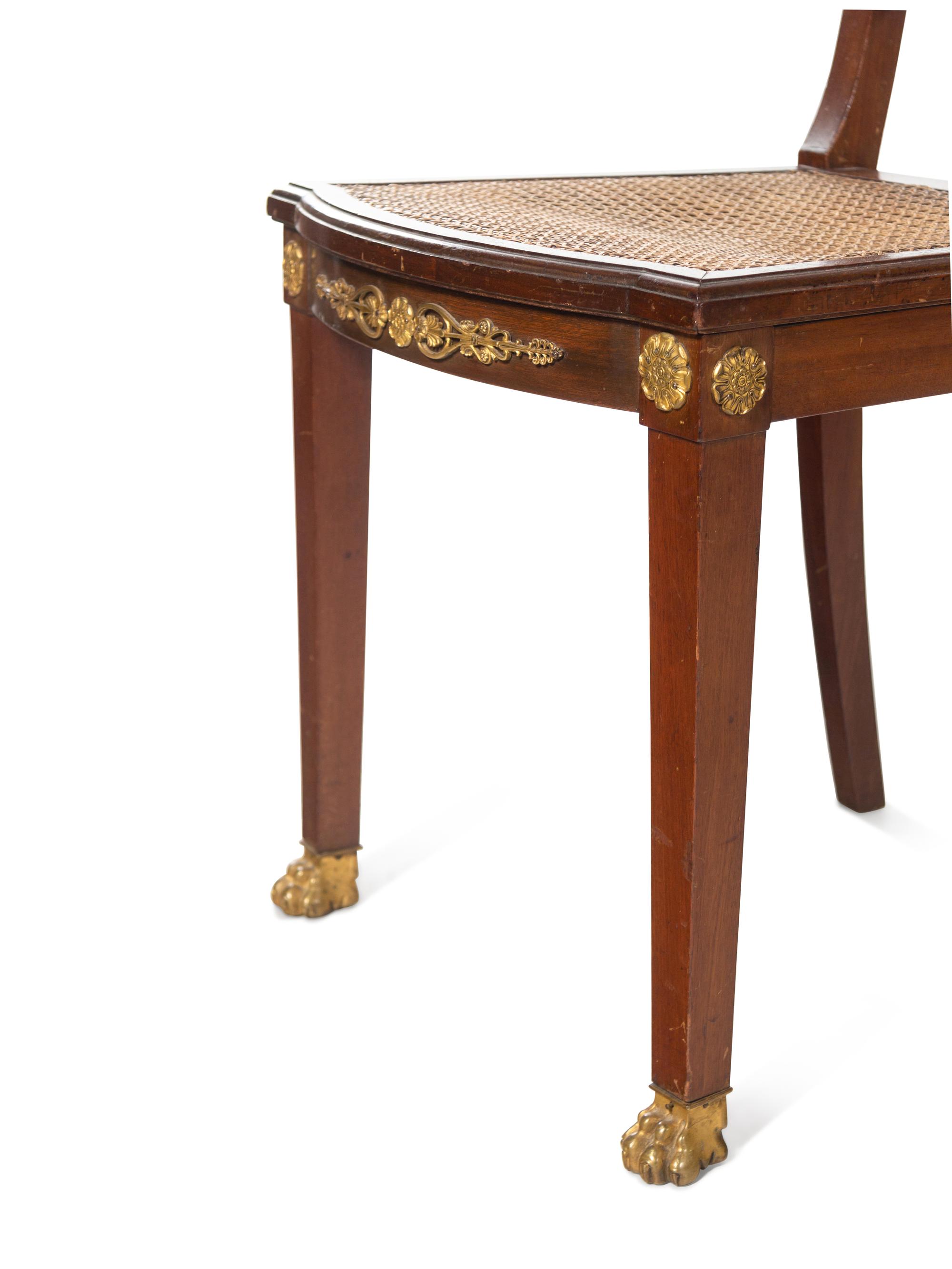 An Assembled Empire Style Gilt Metal Mounted Mahogany Dining Suite