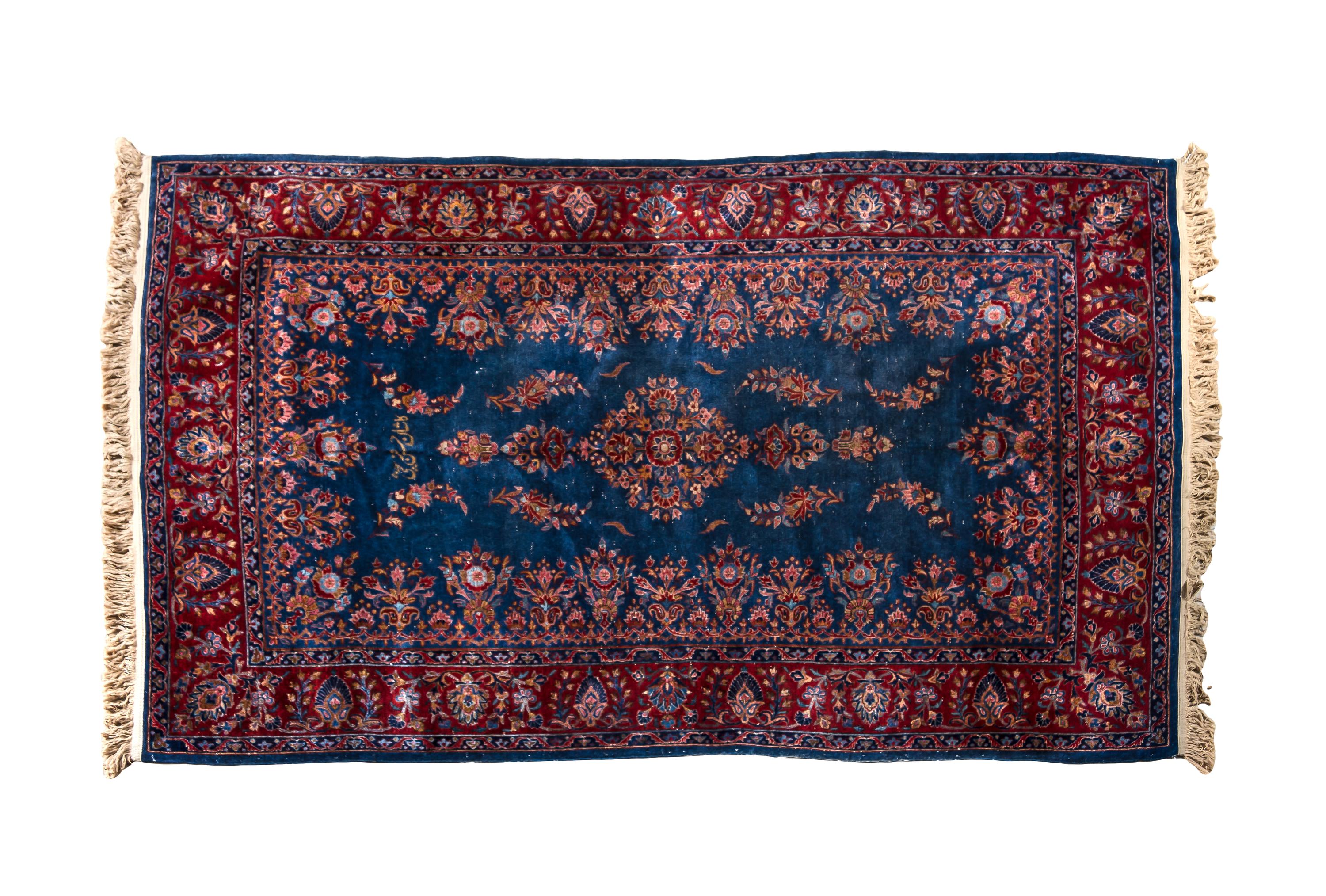 A Sarouk Wool Rug 6 feet 7 inches x 4 feet 3 inches.