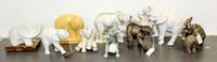A Collection of Nine Porcelain Elephant Figures Height of tallest 7 3/4 inches.
