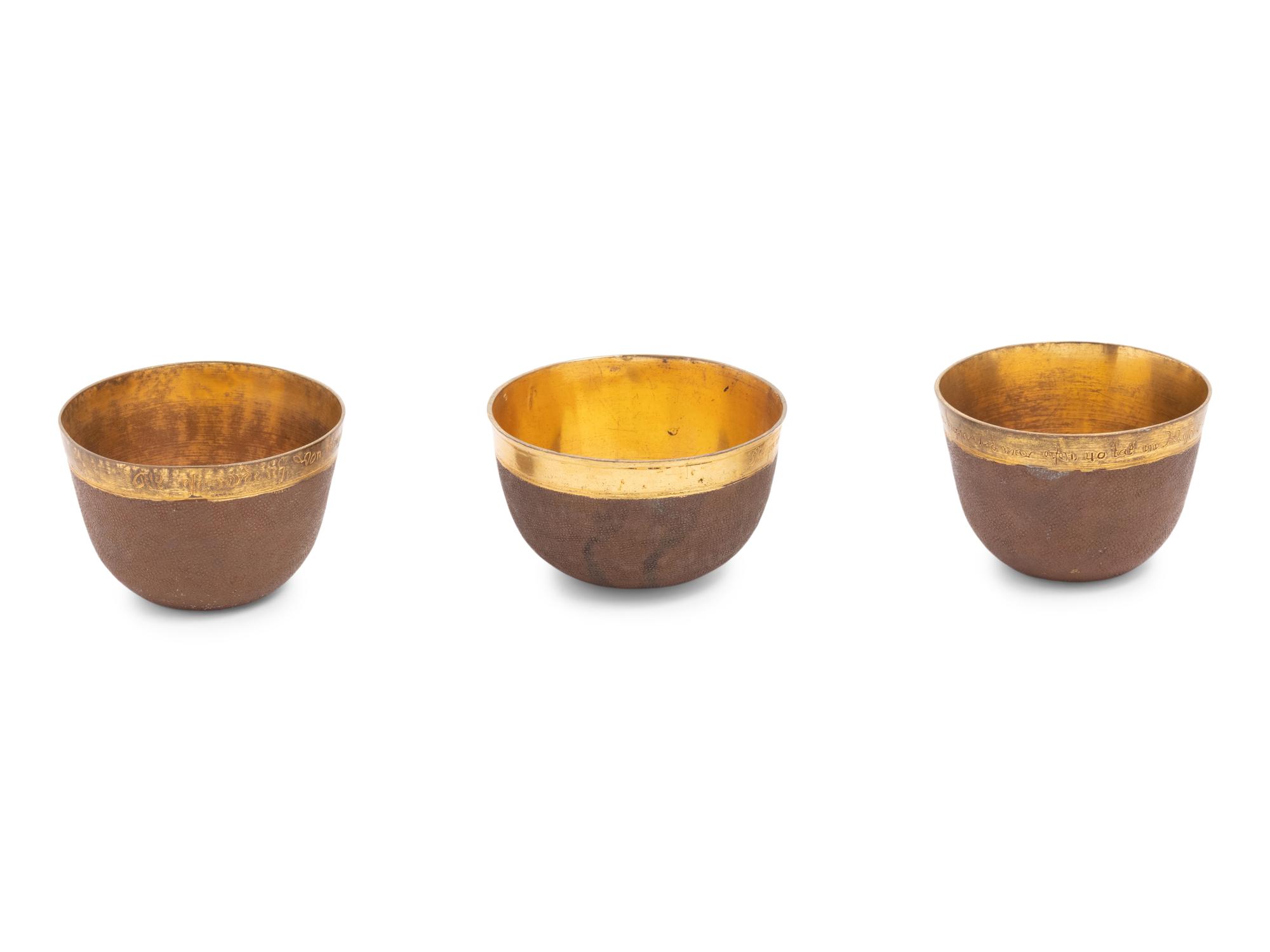 A Group of Three Continental Gilt Metal Herrengrund Cups