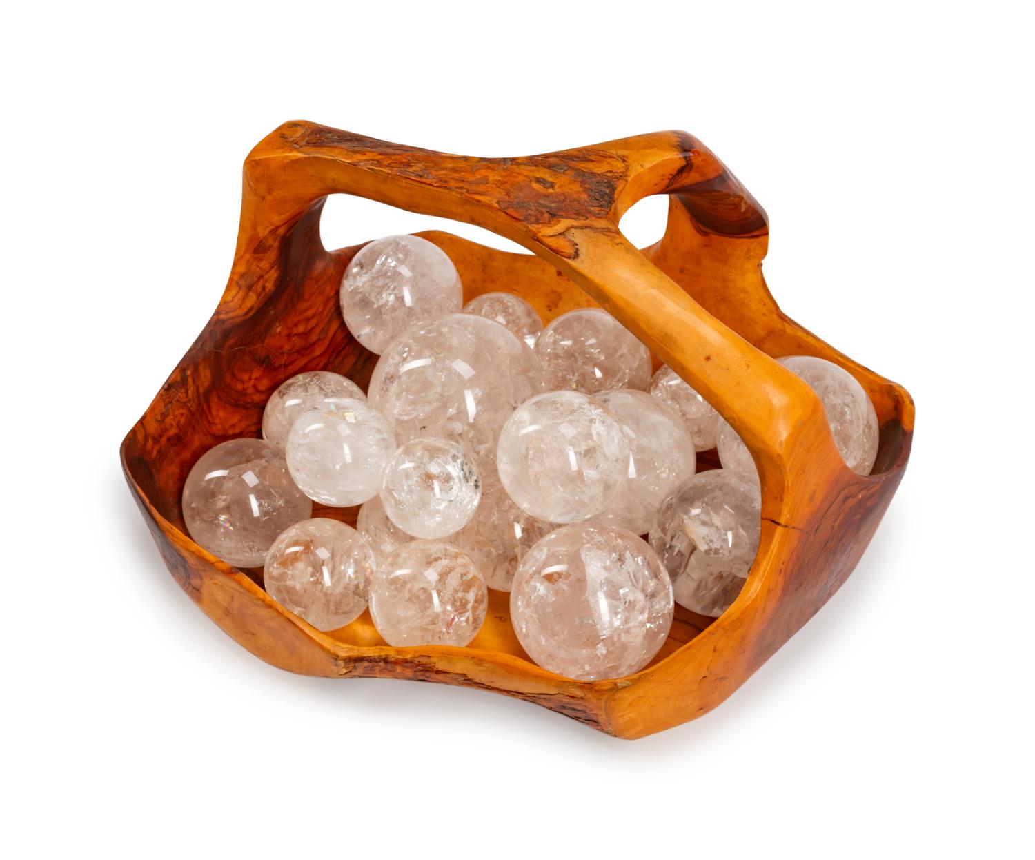 A Continental Carved Wood Basket with Eighteen Rock Crystal Spheres