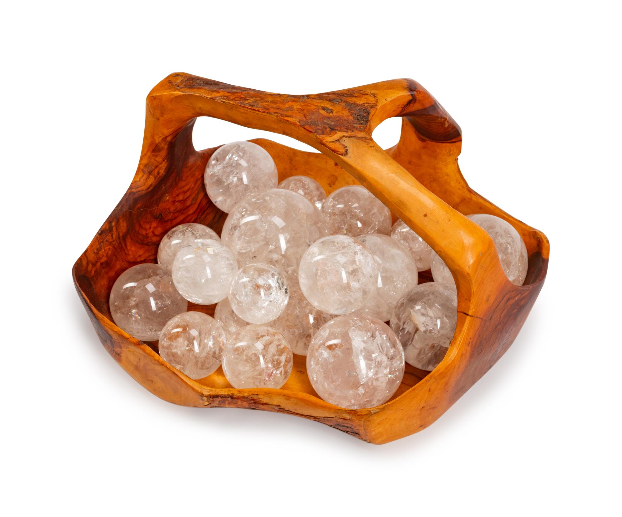 A Continental Carved Wood Basket with Eighteen Rock Crystal Spheres