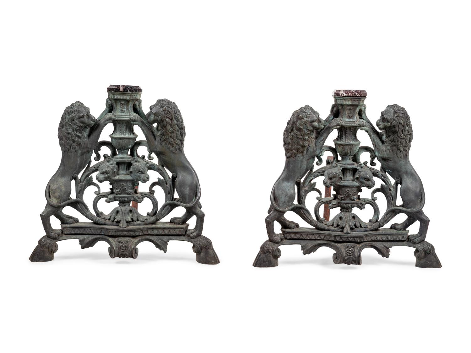 A Pair of Continental Cast Metal Andirons