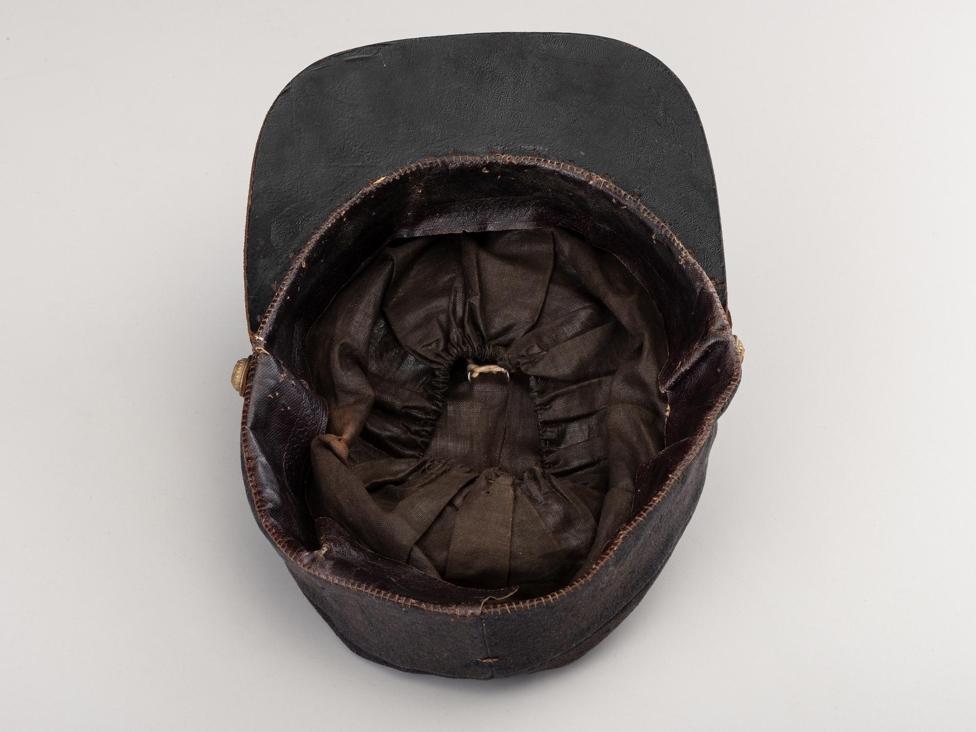 [CIVIL WAR]. A collection of items identified to brothers Robert and Samuel Burnside, Company H, 110th New York Infantry, comprised of a kepi and war-date photographs.