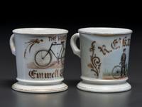 Two Cyclist's Porcelain Shaving Mugs