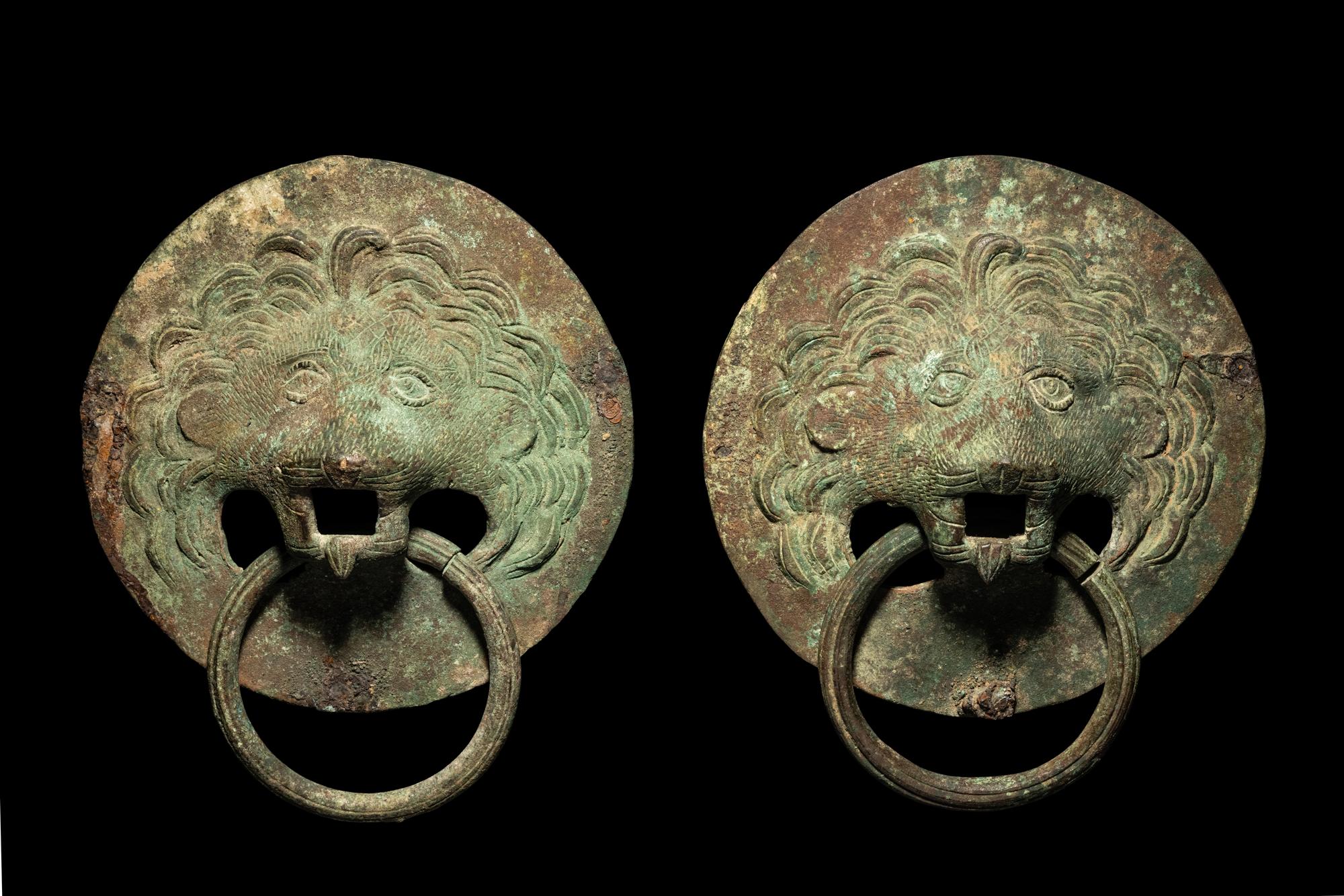 A Pair of Roman Bronze Lion-Headed Handles