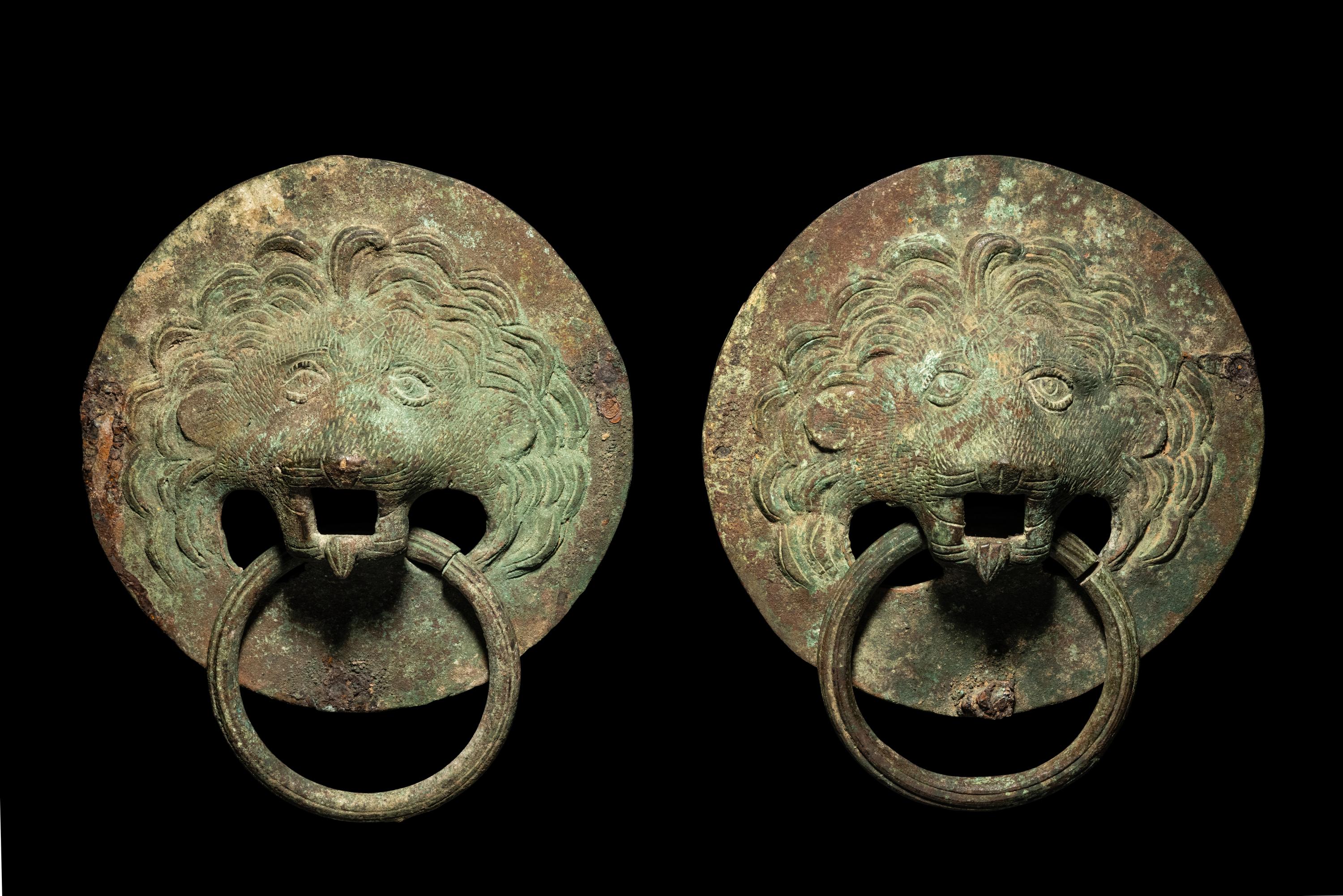 A Pair of Roman Bronze Lion-Headed Handles