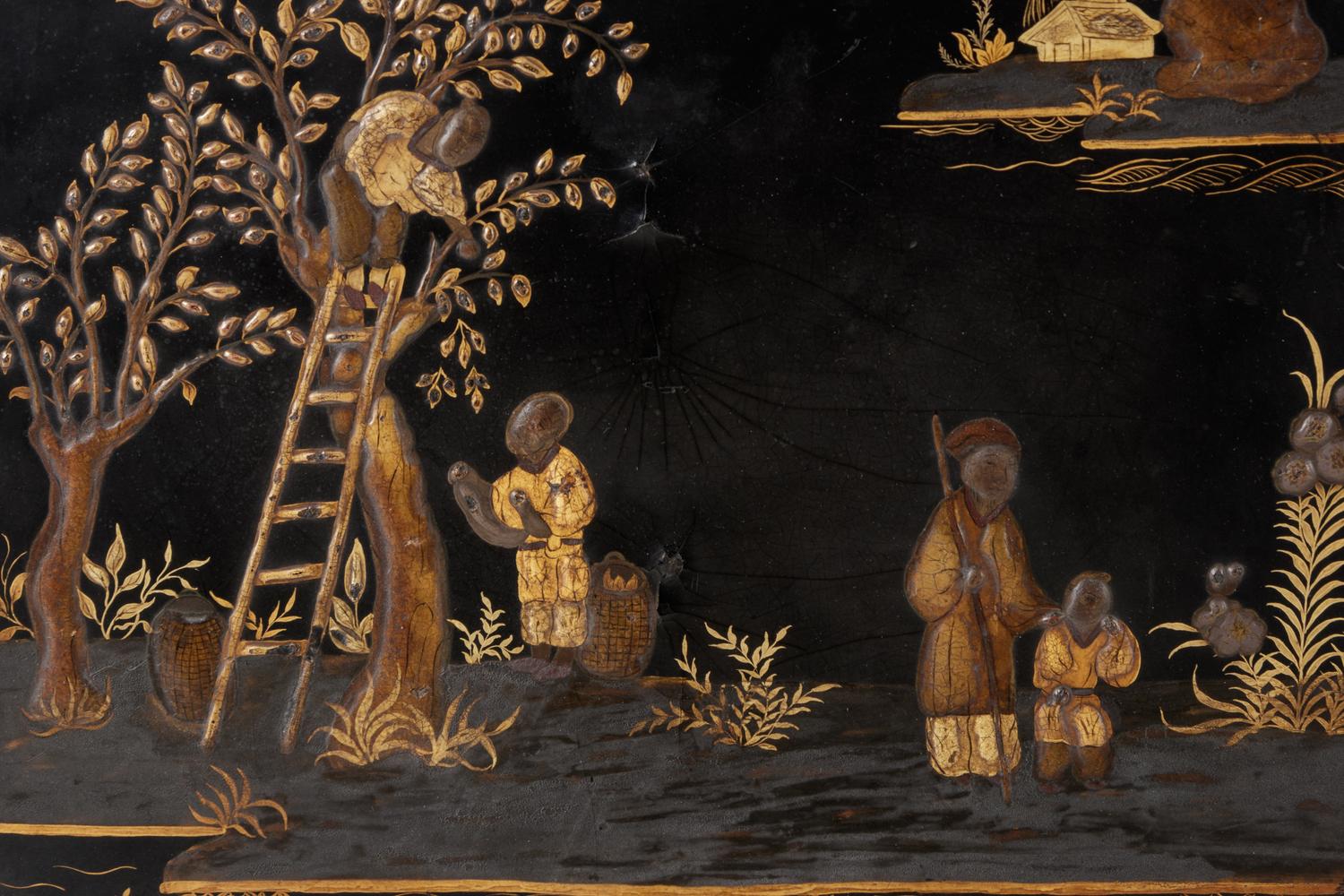 A Pair of Regency Black Lacquered and Chinoiserie Decorated Pole Screens