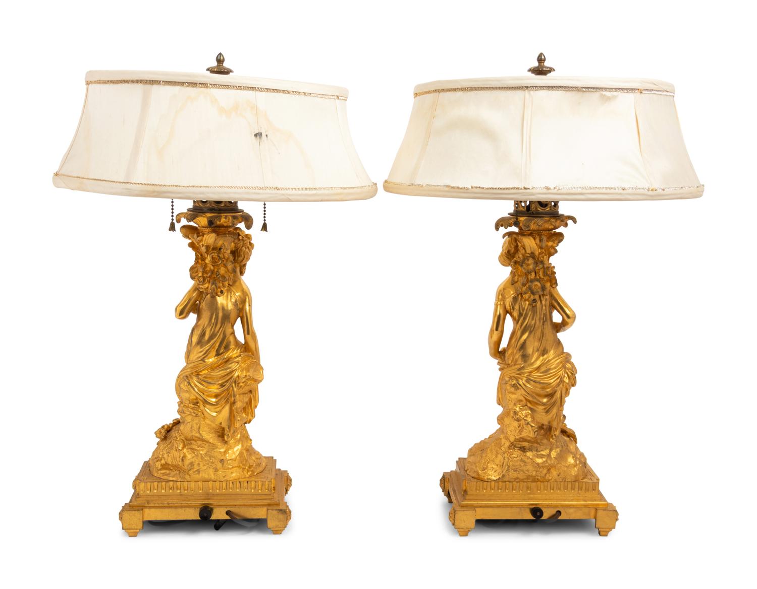 A Pair of French Gilt Bronze Figural Fluid Lamps Converted to Electricity