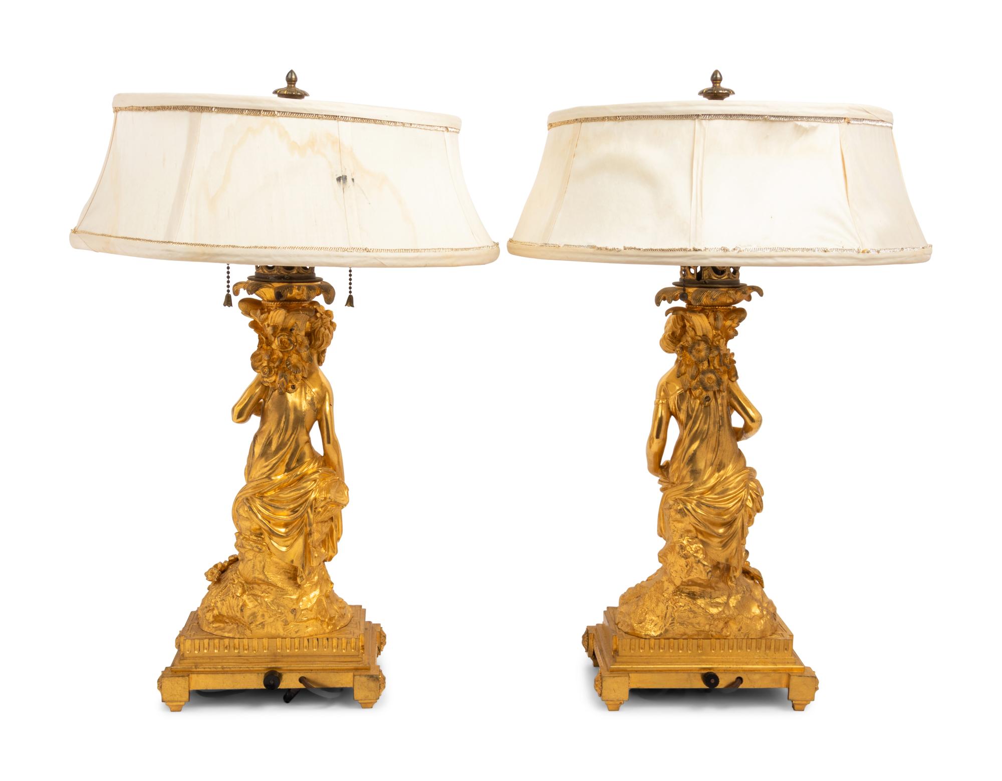 A Pair of French Gilt Bronze Figural Fluid Lamps Converted to Electricity