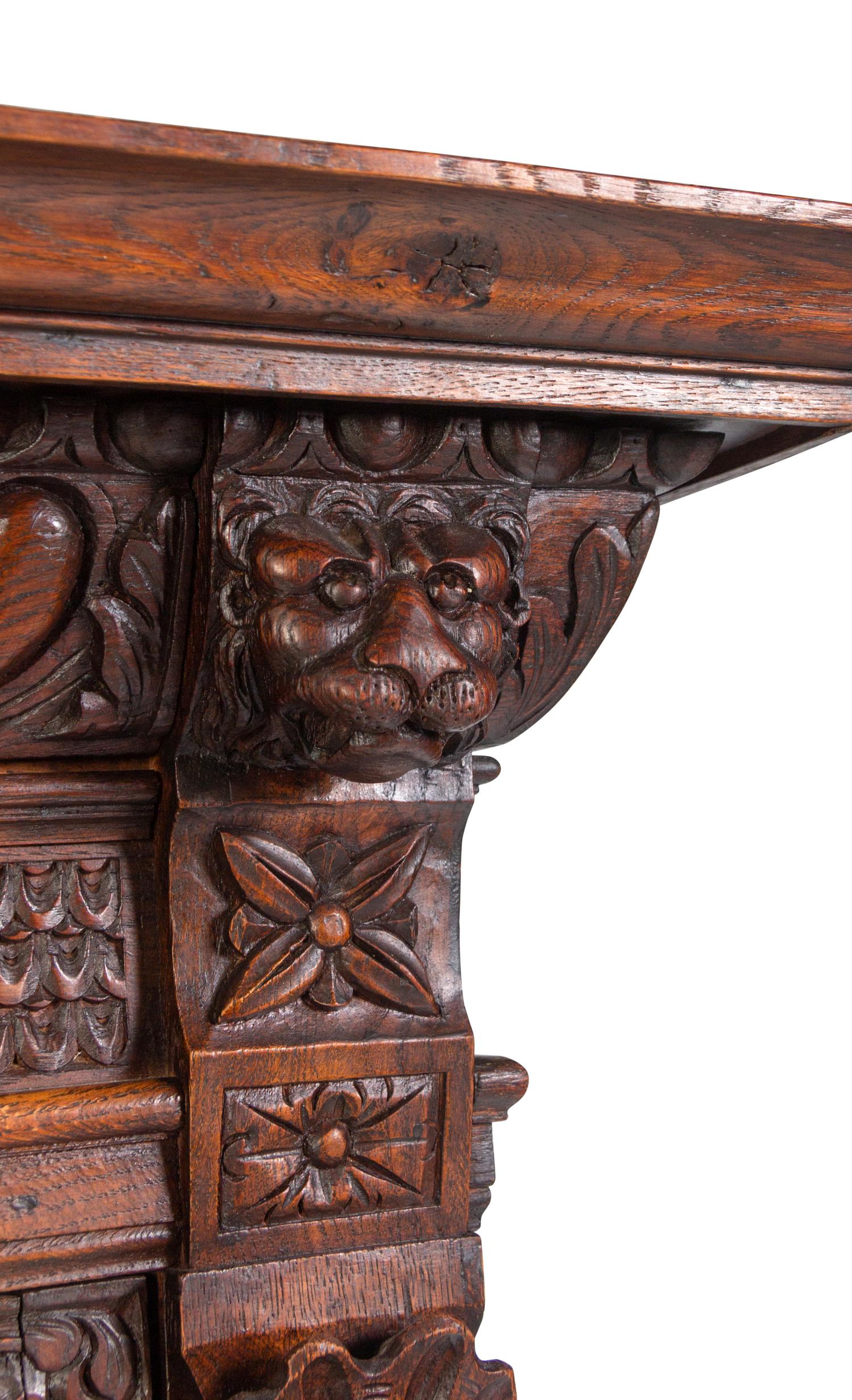 An Italian Renaissance Revival Carved Oak Cabinet