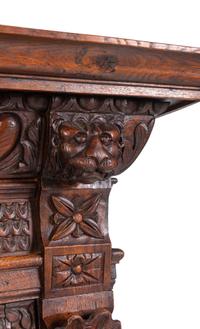 An Italian Renaissance Revival Carved Oak Cabinet