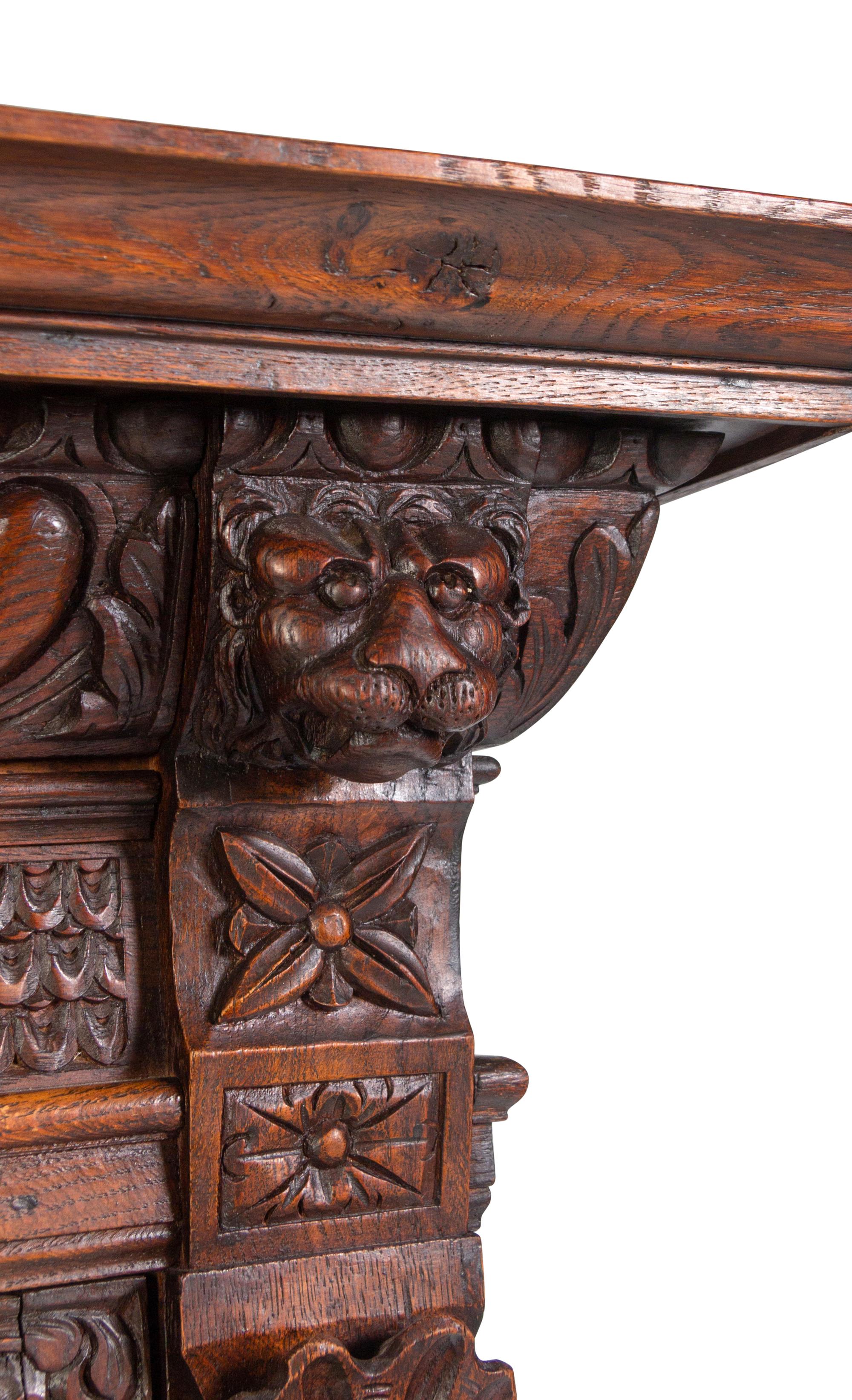 An Italian Renaissance Revival Carved Oak Cabinet