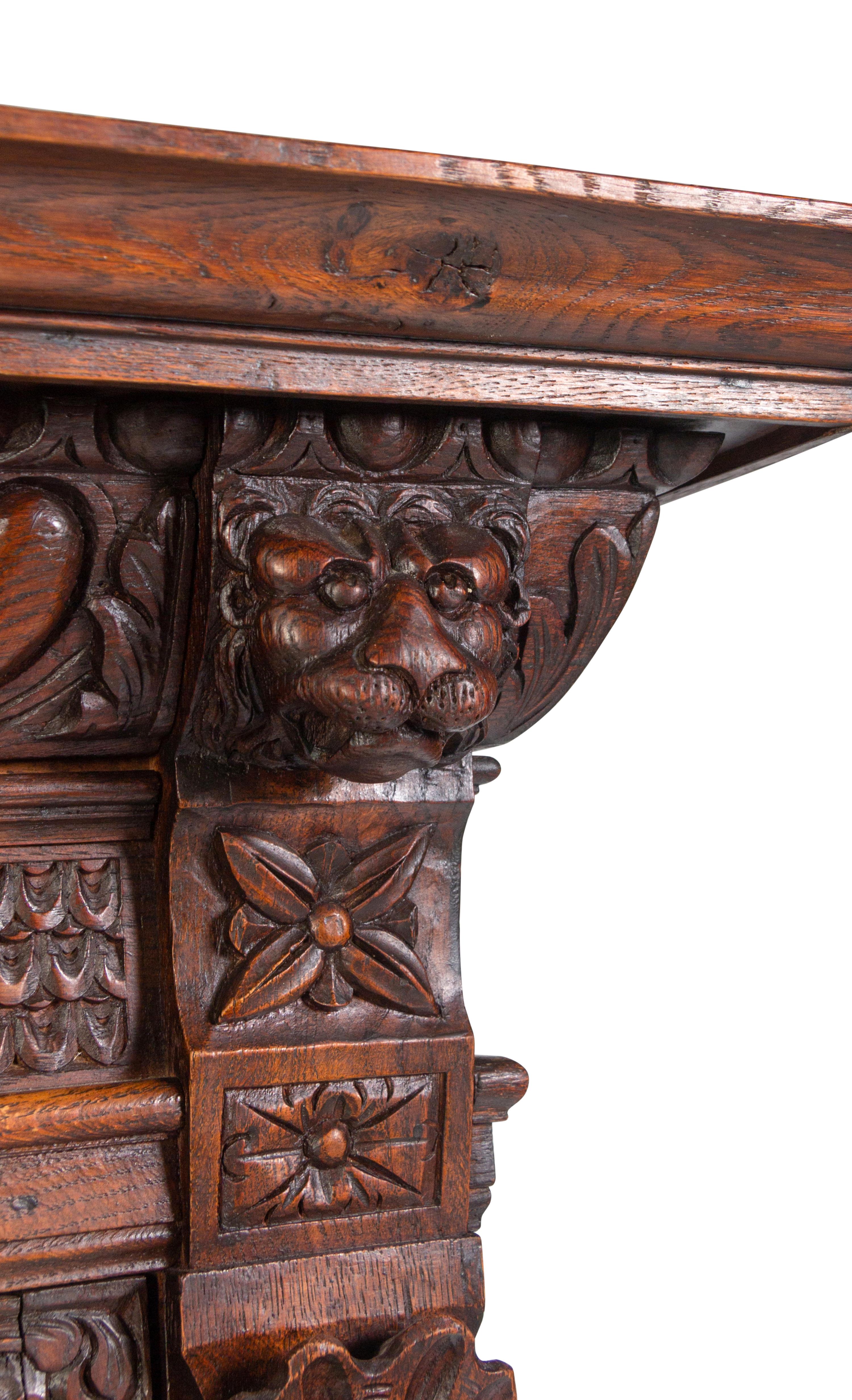 An Italian Renaissance Revival Carved Oak Cabinet