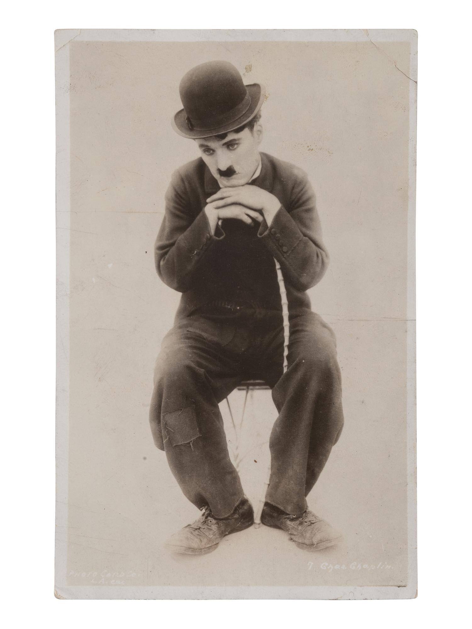 CHAPLIN, Charles (1889-1977). RPPC and portrait featuring Charlie Chaplin as "The Tramp."