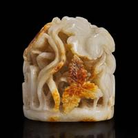 A Chinese reticulated white and russet jade finial 透雕玉炉端