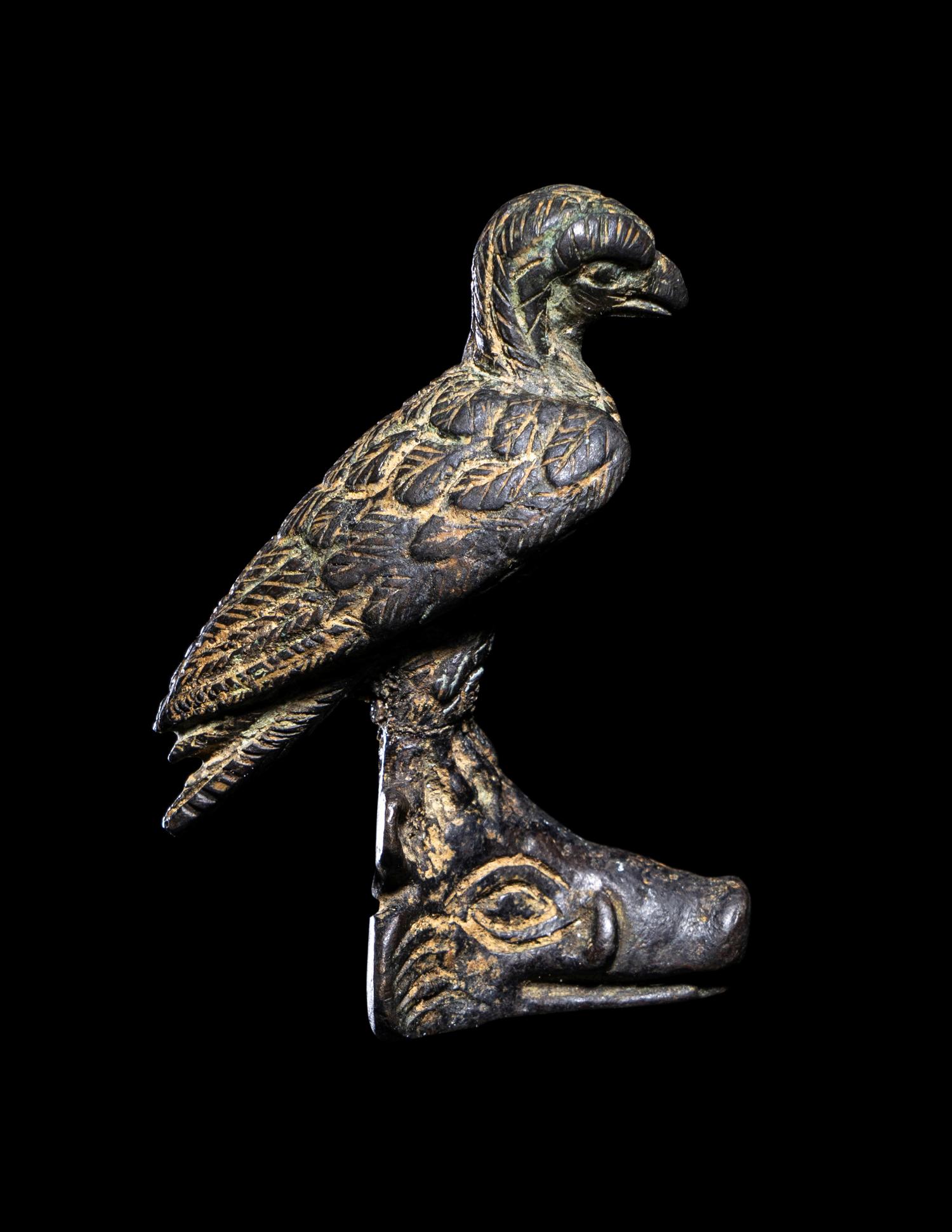 A Roman Bronze Eagle Perched on a Boar's Head