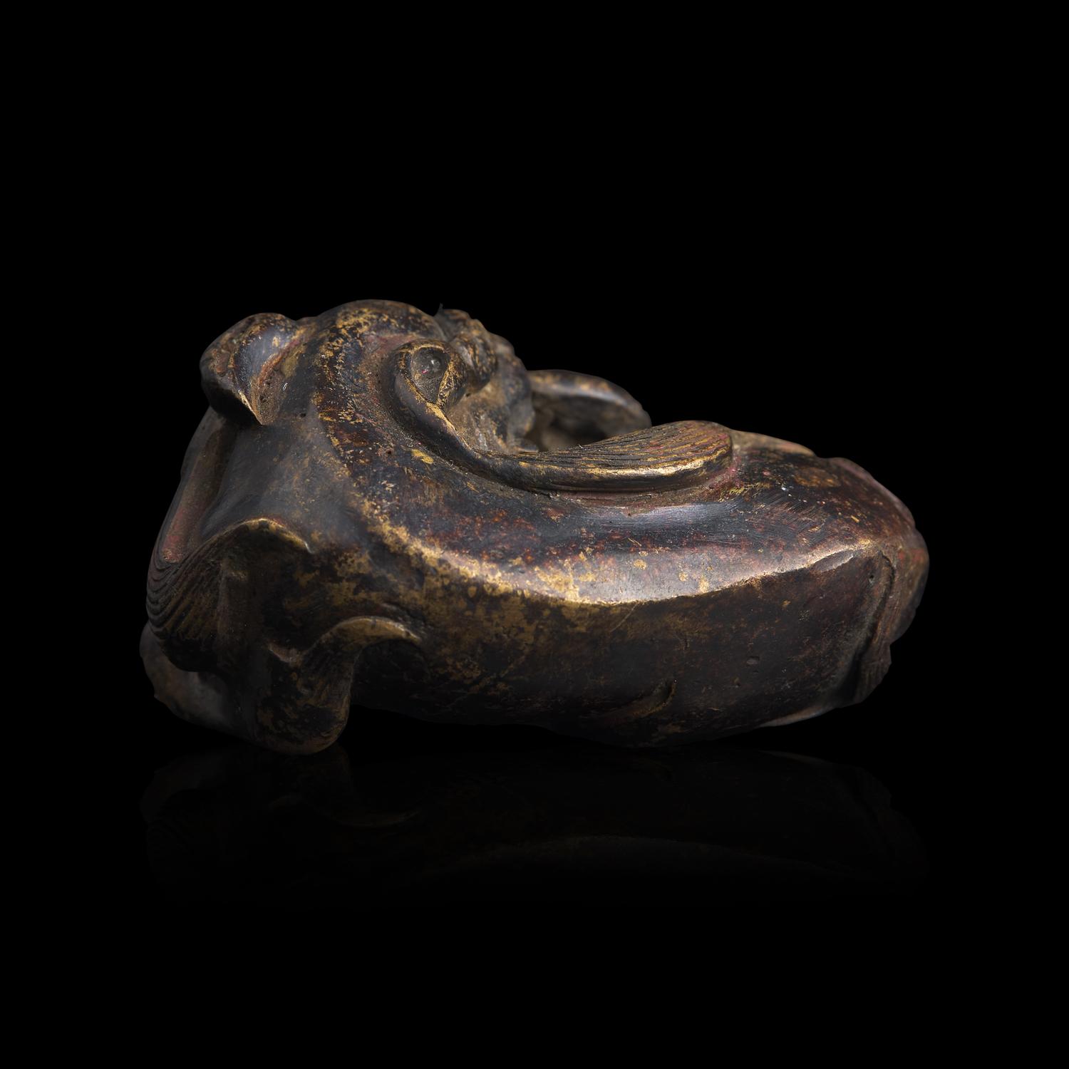 A Chinese Patinated Bronze Figure of a Stylized Lion, Late Ming-Early Qing Dynasty — 明末清初 銅獅鎮紙