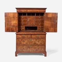 A William & Mary oyster veneered walnut secretary bookcase circa 1700