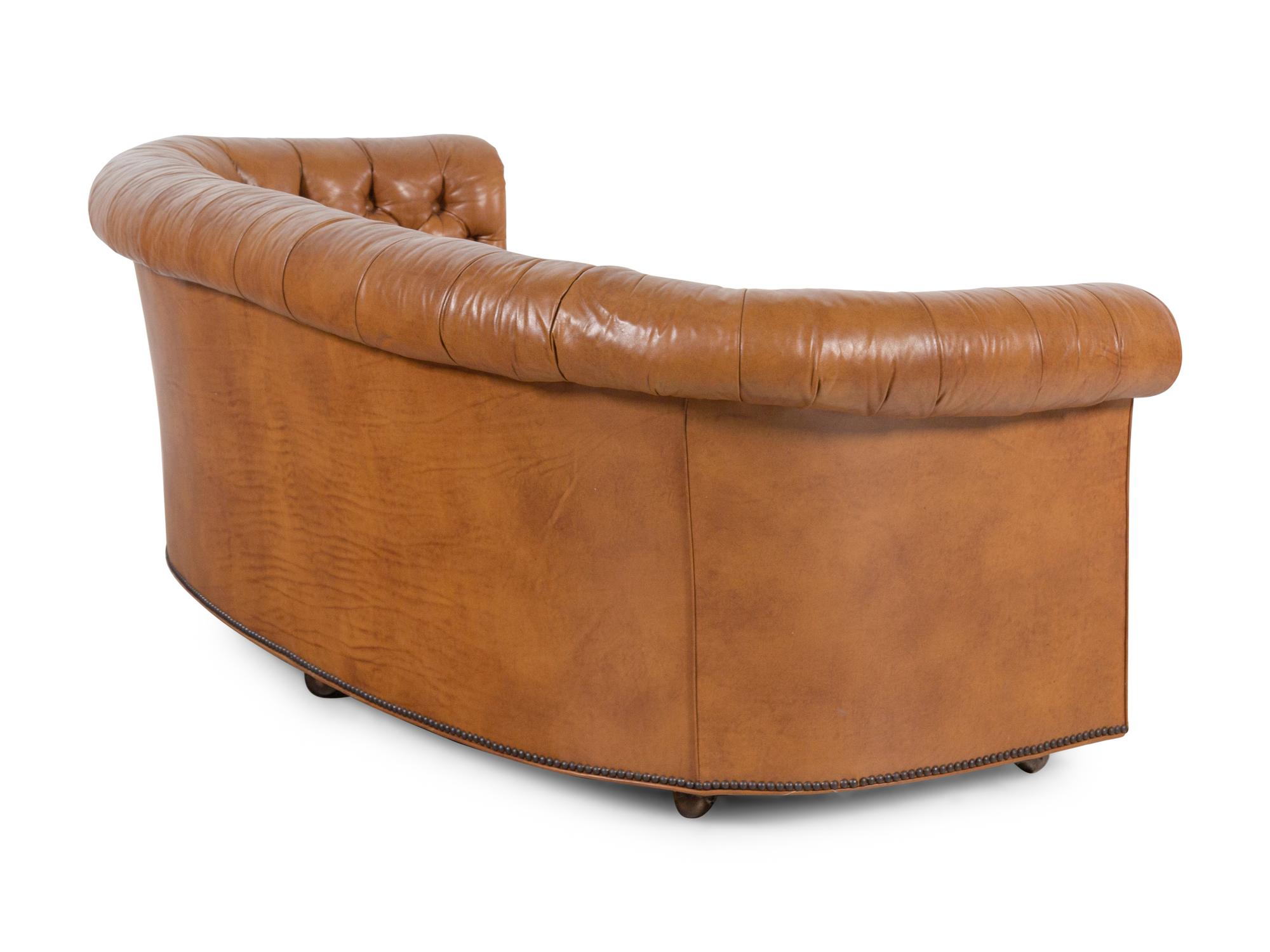 A Pair of Faux Leather Upholstered Chesterfield Sofas