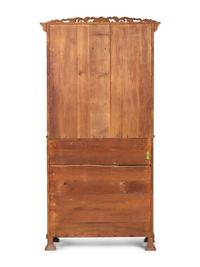 A Classical Style Carved and Highly Figured Tiger Maple Slant Front Desk