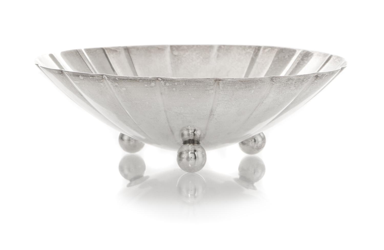 An American Silver Small Bowl, Tiffany & Co., New York, NY, 1940, circular with scalloped sides, raised on three ball feet, engraved in