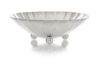 An American Silver Small Bowl, Tiffany & Co., New York, NY, 1940, circular with scalloped sides, raised on three ball feet, engraved in