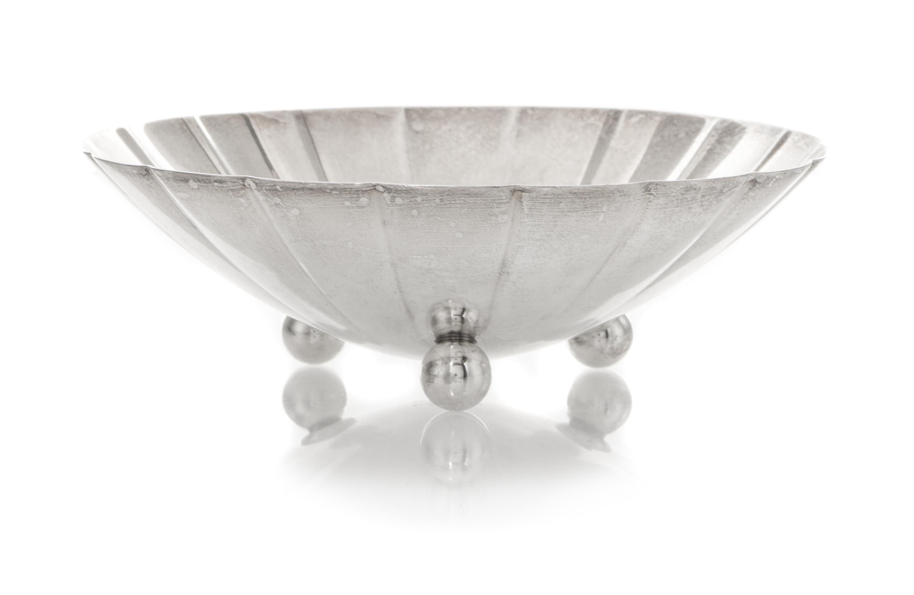 An American Silver Small Bowl, Tiffany & Co., New York, NY, 1940, circular with scalloped sides, raised on three ball feet, engraved in