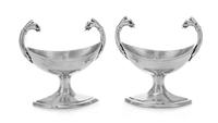 A Pair of German Silver Salts, Maker's Mark Schott, 19th Century, the twin handles worked to show animal masks, raised on a lozenge for