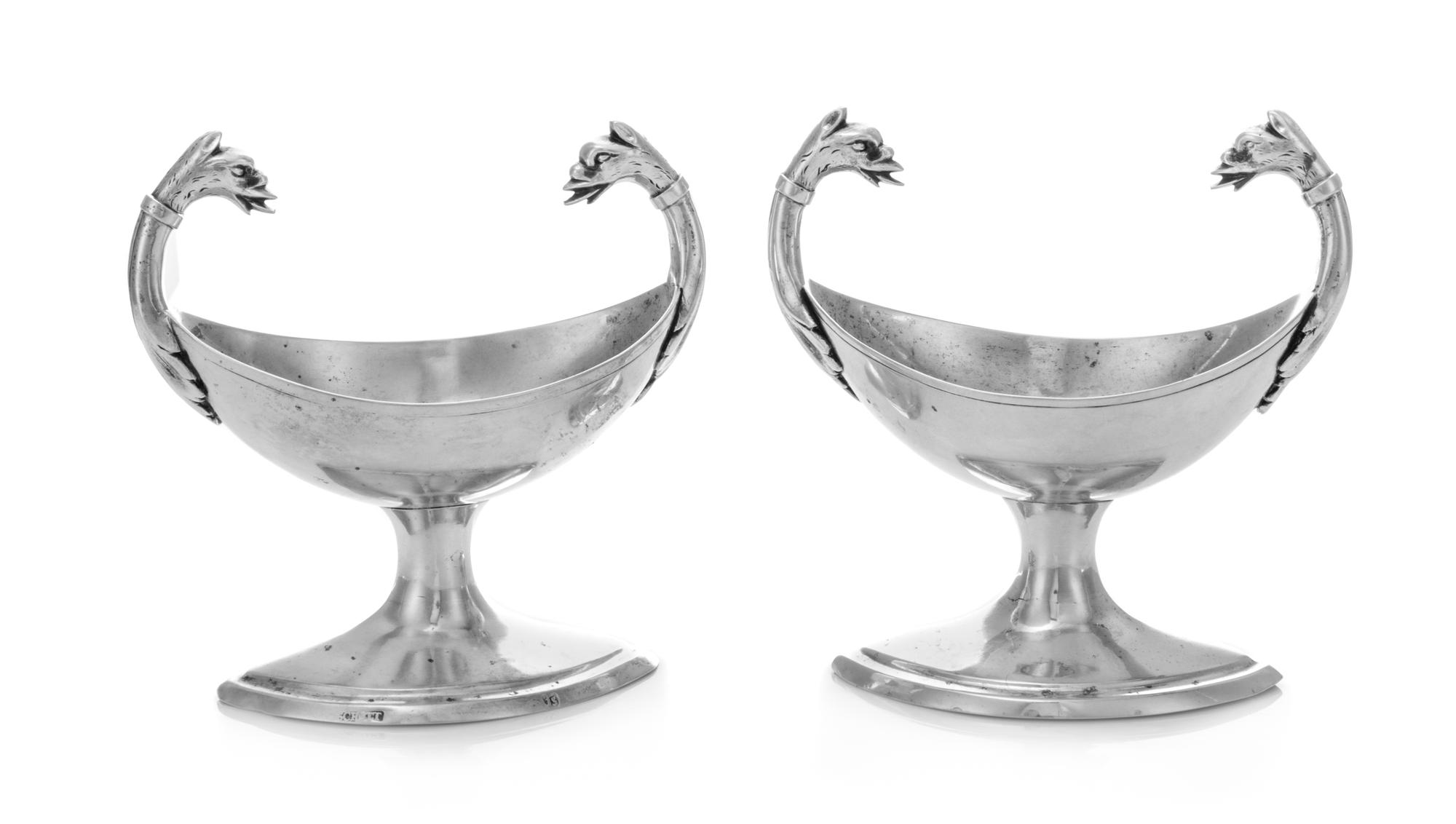 A Pair of German Silver Salts, Maker's Mark Schott, 19th Century, the twin handles worked to show animal masks, raised on a lozenge for