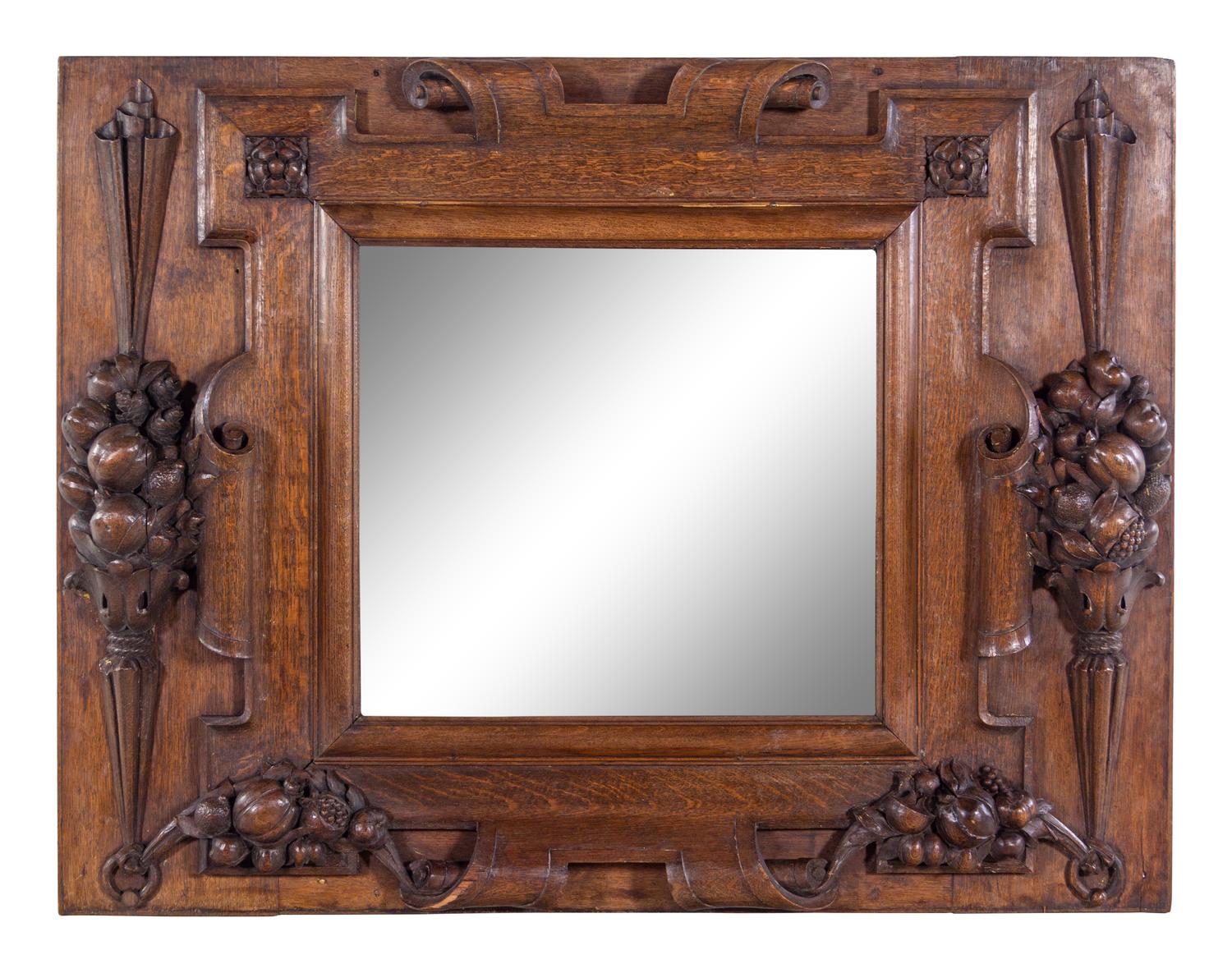 A Continental Carved Oak Mirror