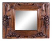 A Continental Carved Oak Mirror