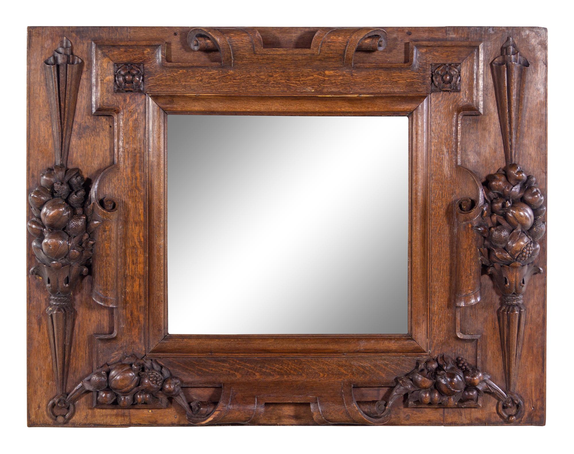A Continental Carved Oak Mirror