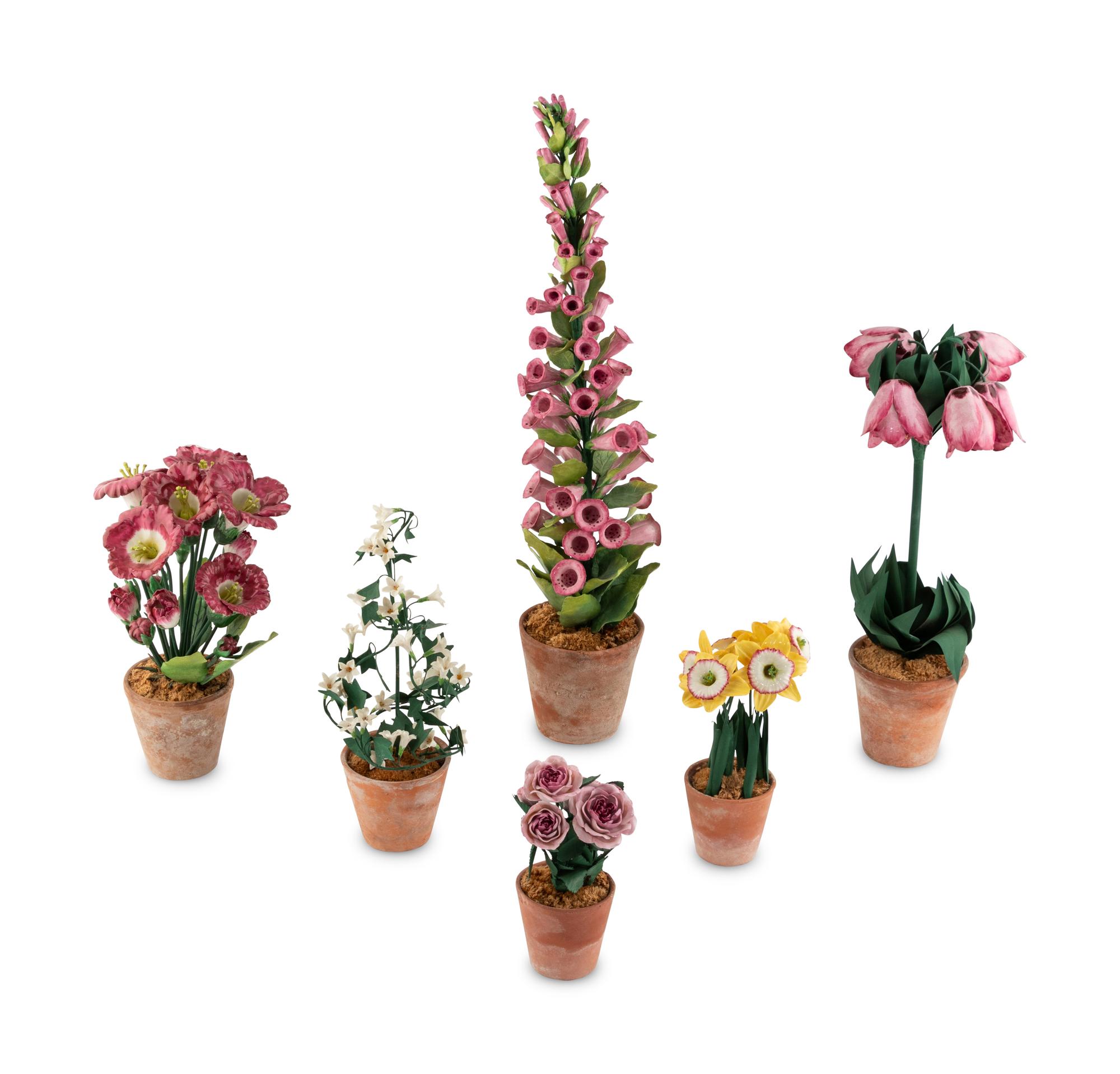 A Group of Tole and Porcelain Models of Flowers