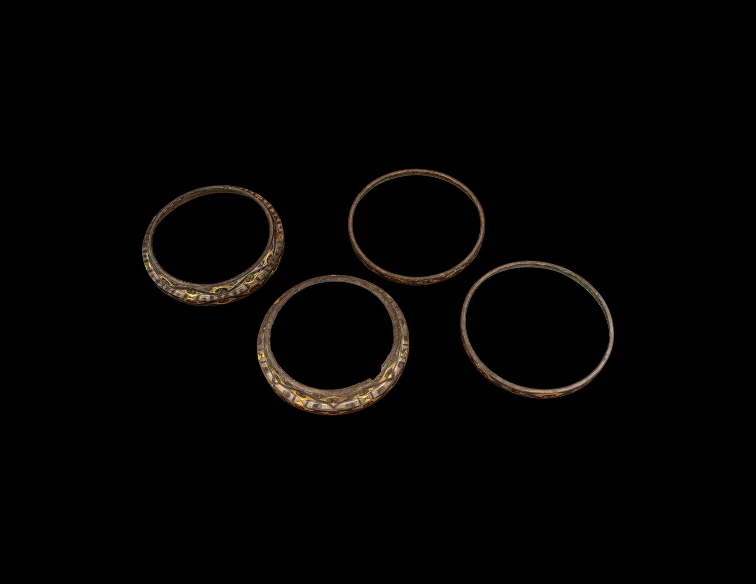 A Group of Four Chinese Gold and Silver Inlaid Bronze Fittings from Hu Vessels