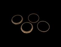 A Group of Four Chinese Gold and Silver Inlaid Bronze Fittings from Hu Vessels