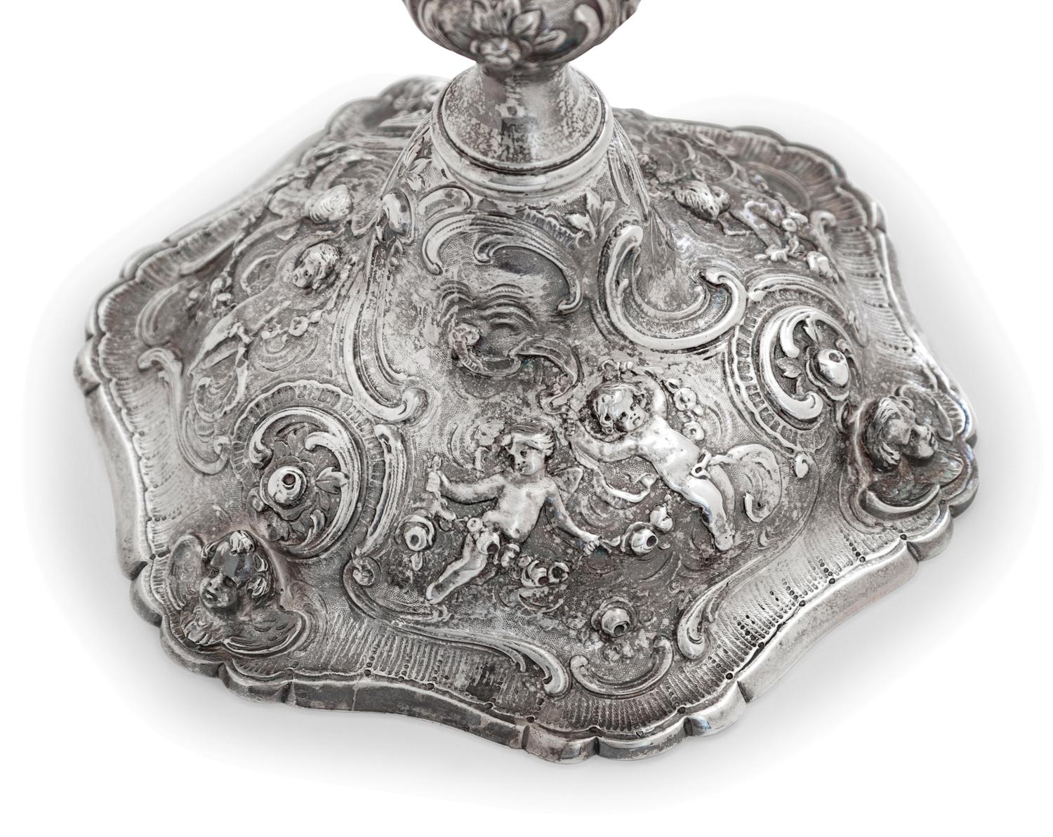 A Set of Four Rococo Revival Silver Candlesticks