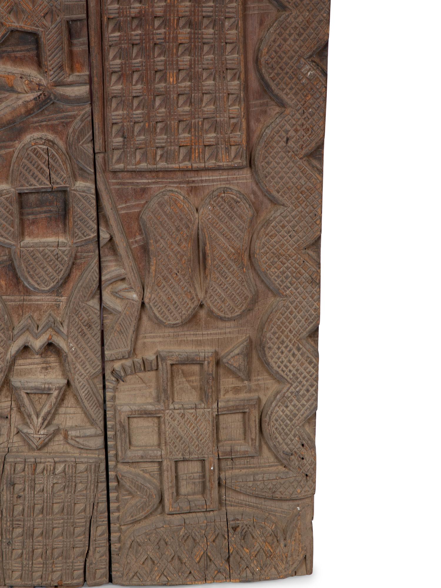 An African Carved Wood Panel — 20TH CENTURY