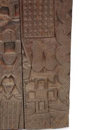 An African Carved Wood Panel — 20TH CENTURY