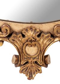 A Painted and Parcel Giltwood Mirror