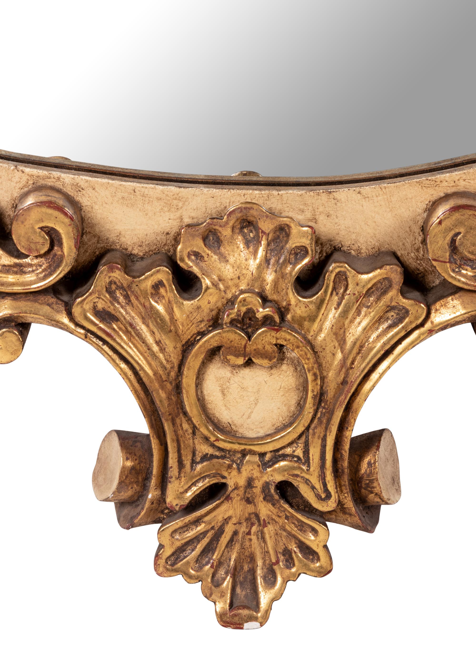 A Painted and Parcel Giltwood Mirror