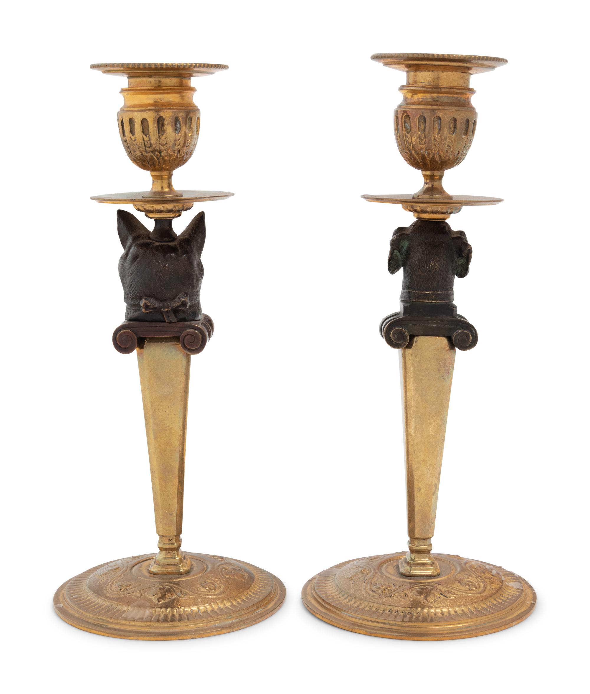 A Pair of Continental Gilt and Patinated Bronze Figural Candlesticks