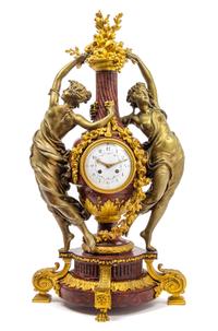 A French Gilt and Patinated Bronze Figural Mantel Clock