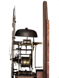 An English Tall Case Clock with Finely Carved Oak Case