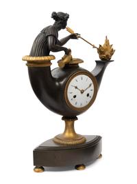 A French Neoclassical Gilt and Patinated Bronze "Oil Lamp" Clock