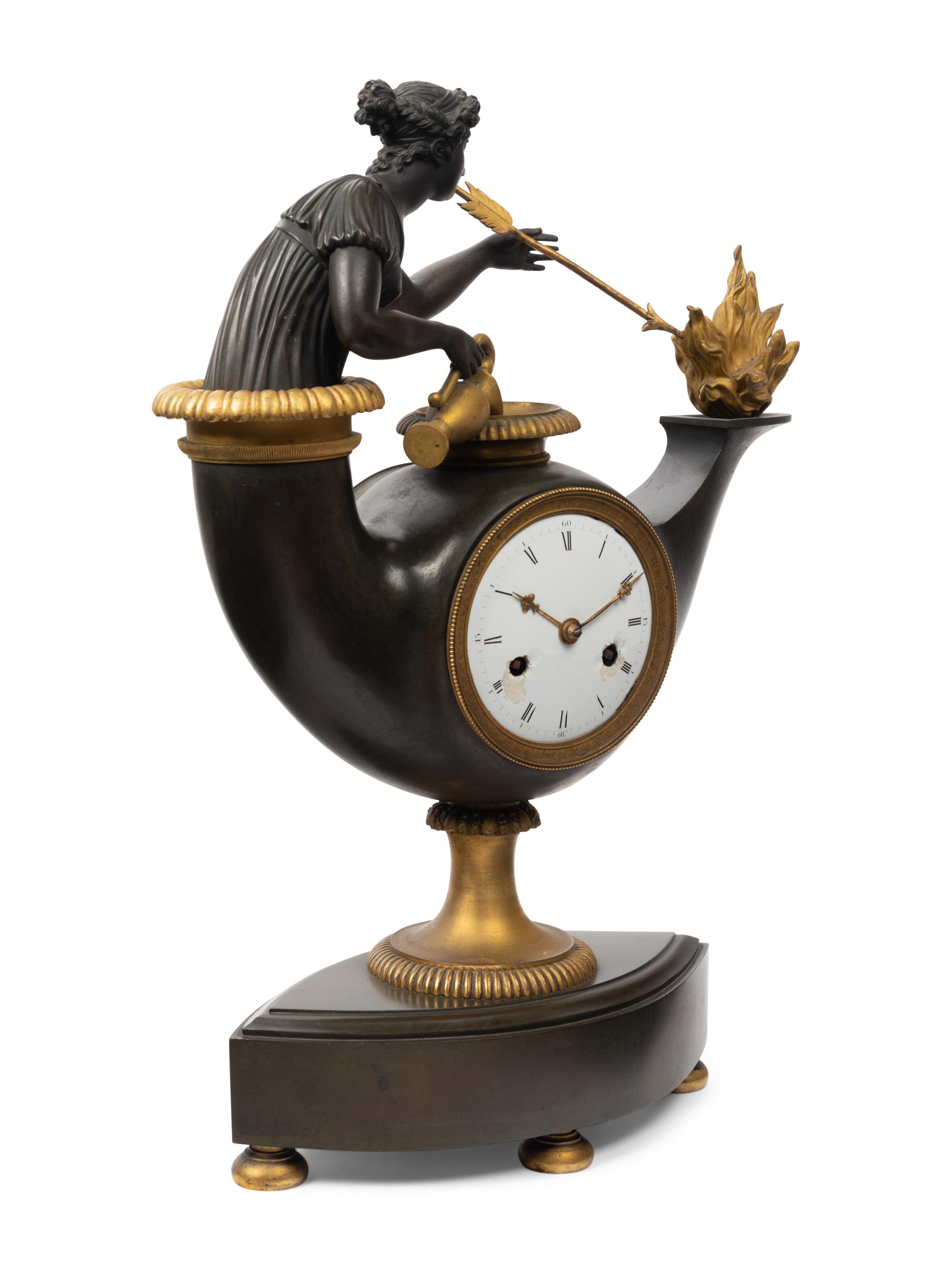 A French Neoclassical Gilt and Patinated Bronze "Oil Lamp" Clock