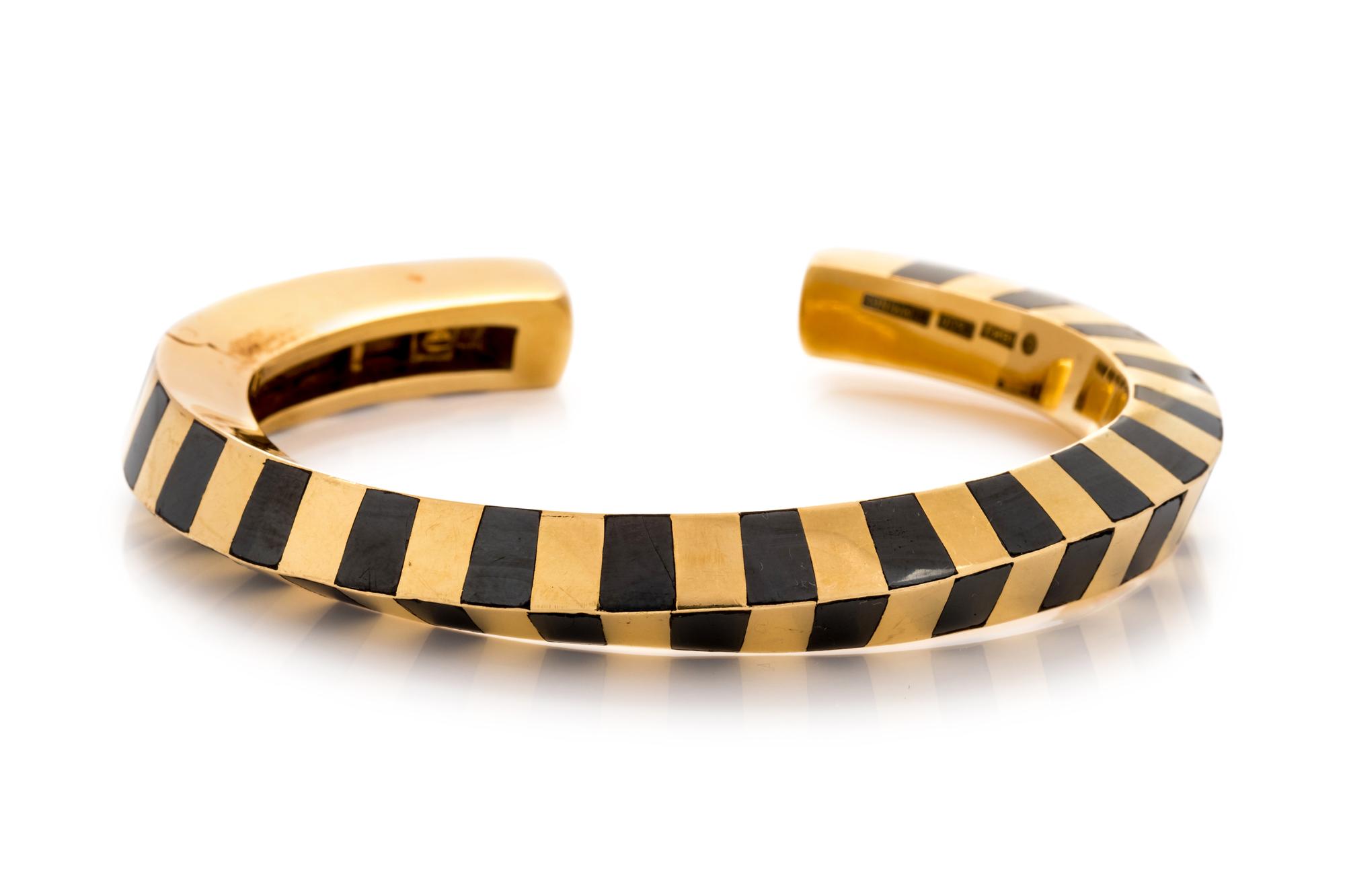 TIFFANY & CO., ANGELA CUMMINGS, YELLOW GOLD AND HEMATITE CUFF BRACELET